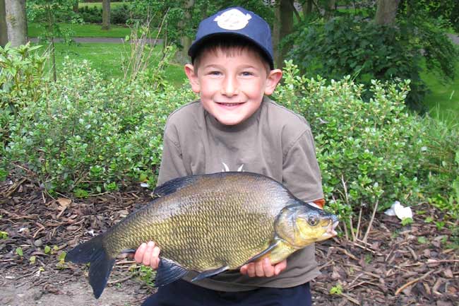 Young seven year old James Gibson of LPAA with a bream from Leazes Park.